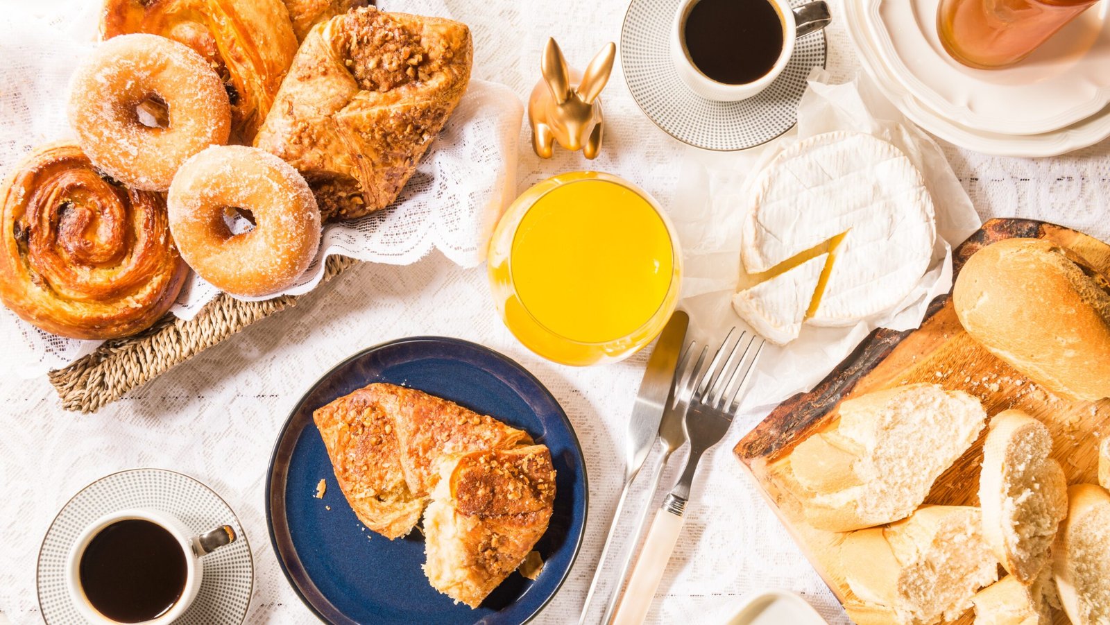 French breakfast with Pastries, Bread, Cheese and Coffee