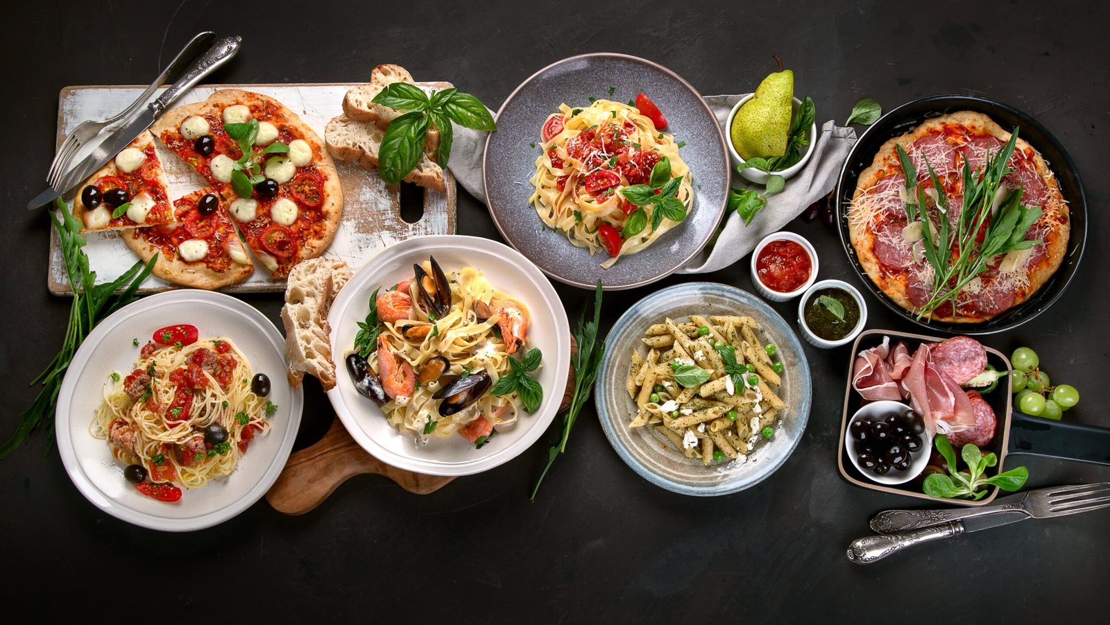 Various Italian dishes on a wooden table